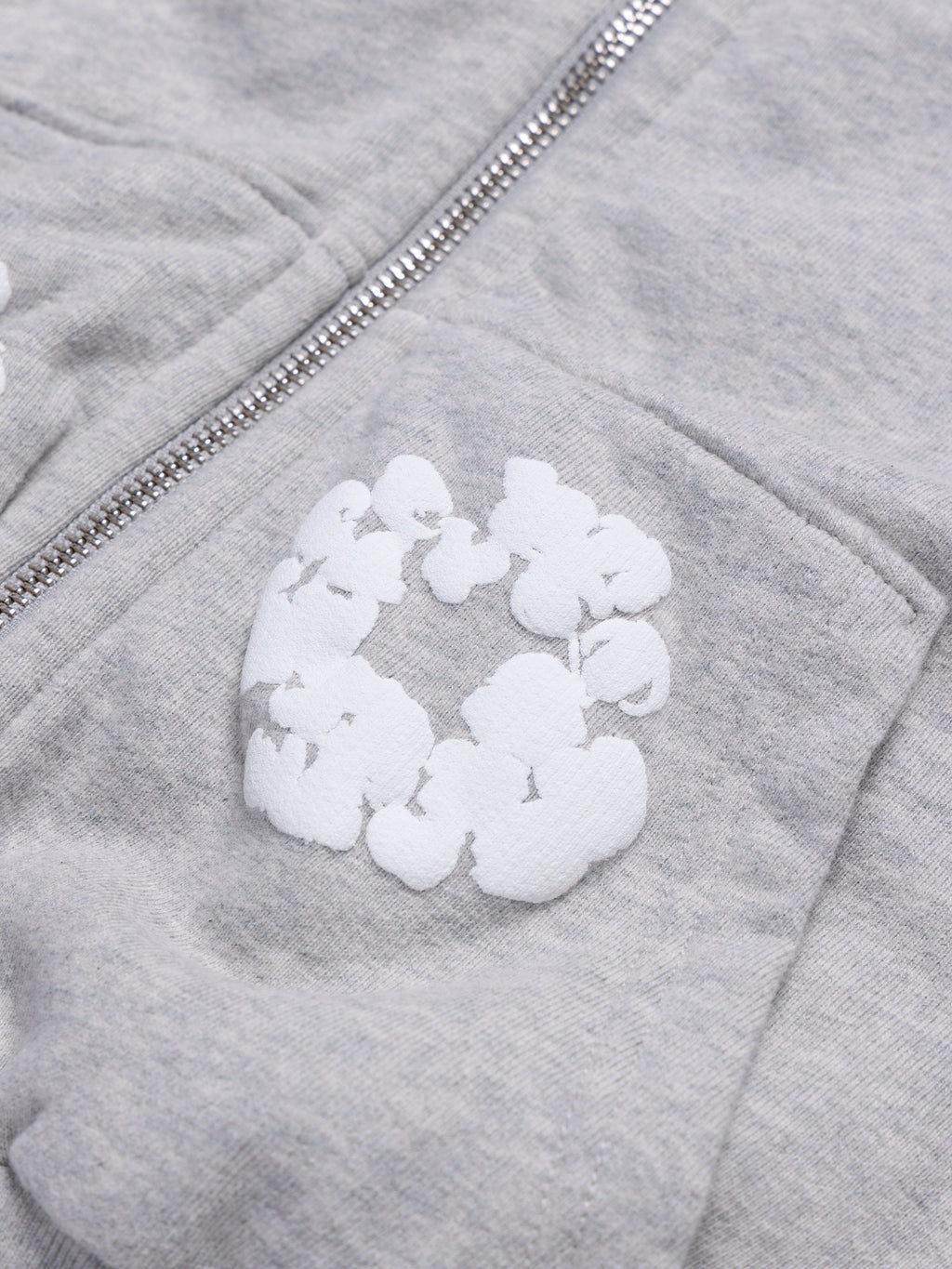 Gray Denim Tears hoodie with a white patch on the chest