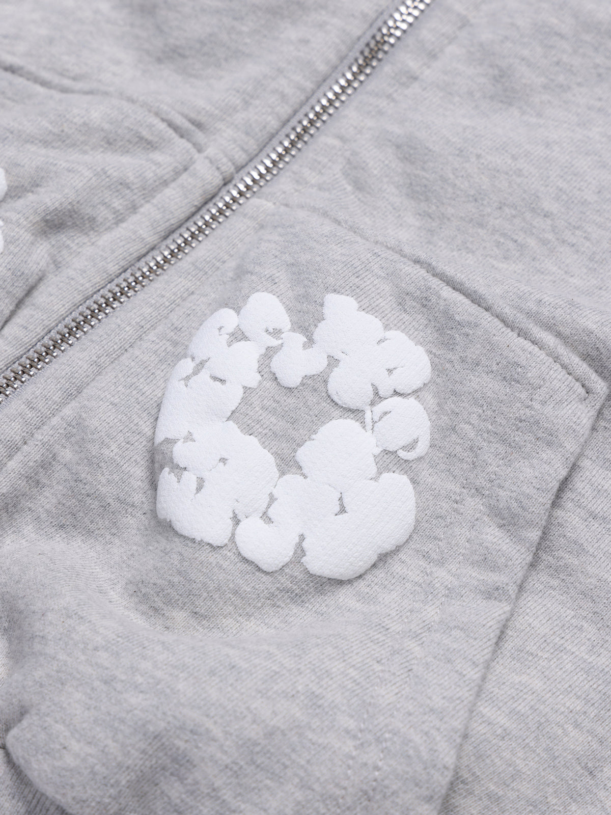 Gray Denim Tears hoodie with a white patch on the chest